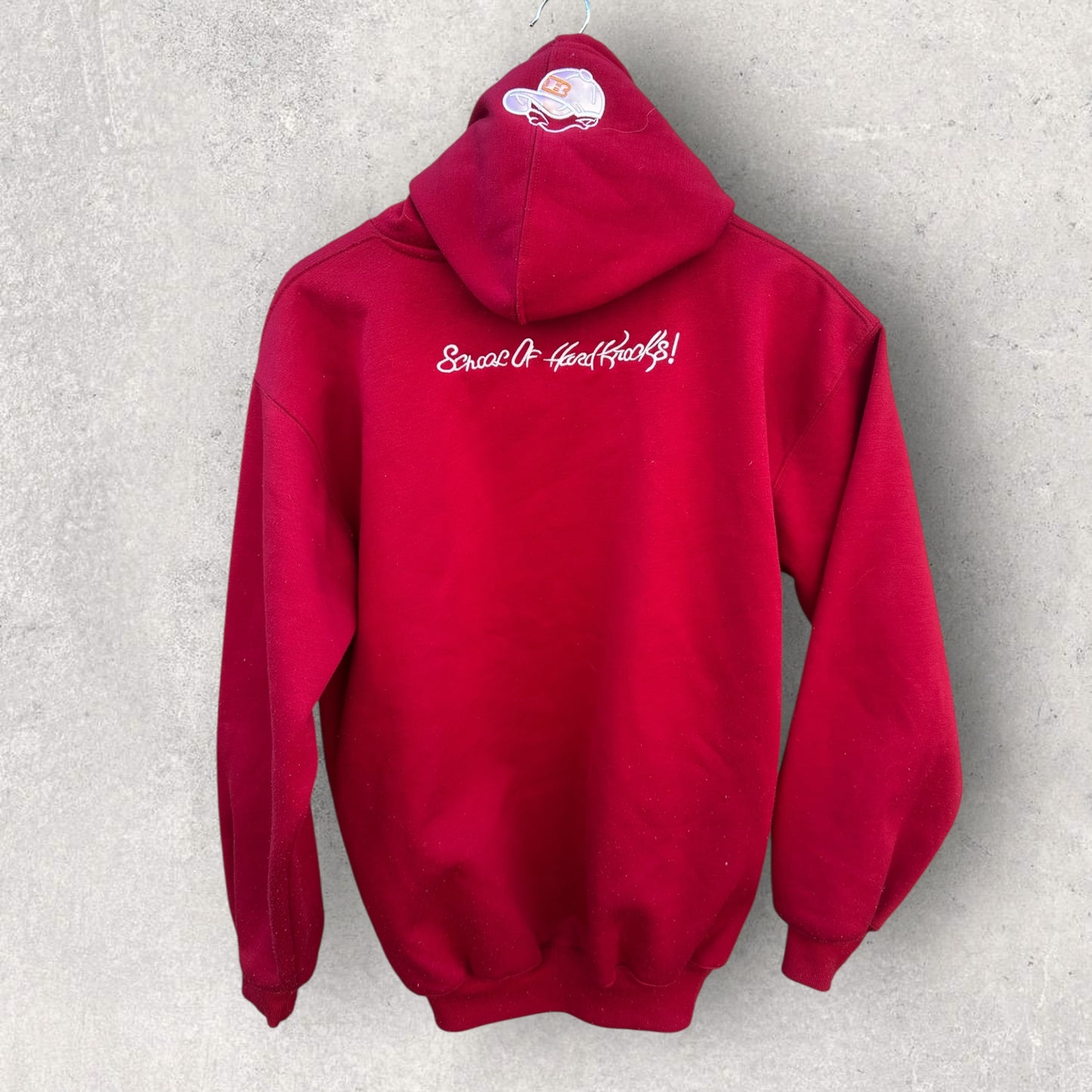 SCHOOL OF HARD KNOCKS RED PULLOVER HOODED JUMPER