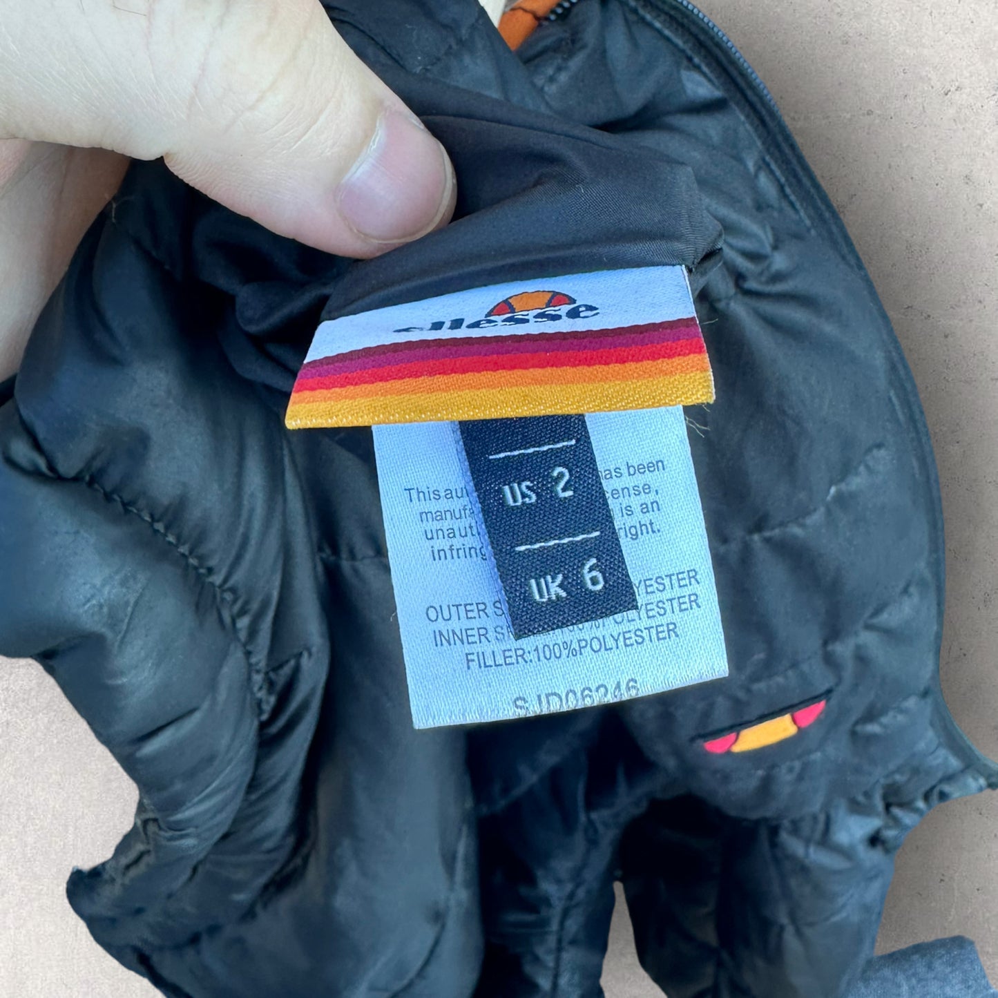 ELLESSE BLACK REVERSE PUFFER JACKET