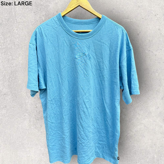 NIKE LOOSE FIT LIGHT BLUE SHORT SLEEVED SHIRT