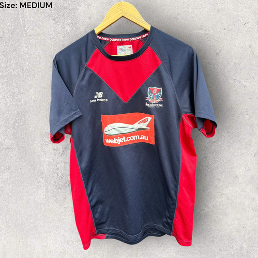 MELBOURNE DEMOMS ONFIELD NEW BALANCE TRAINING SHIRT