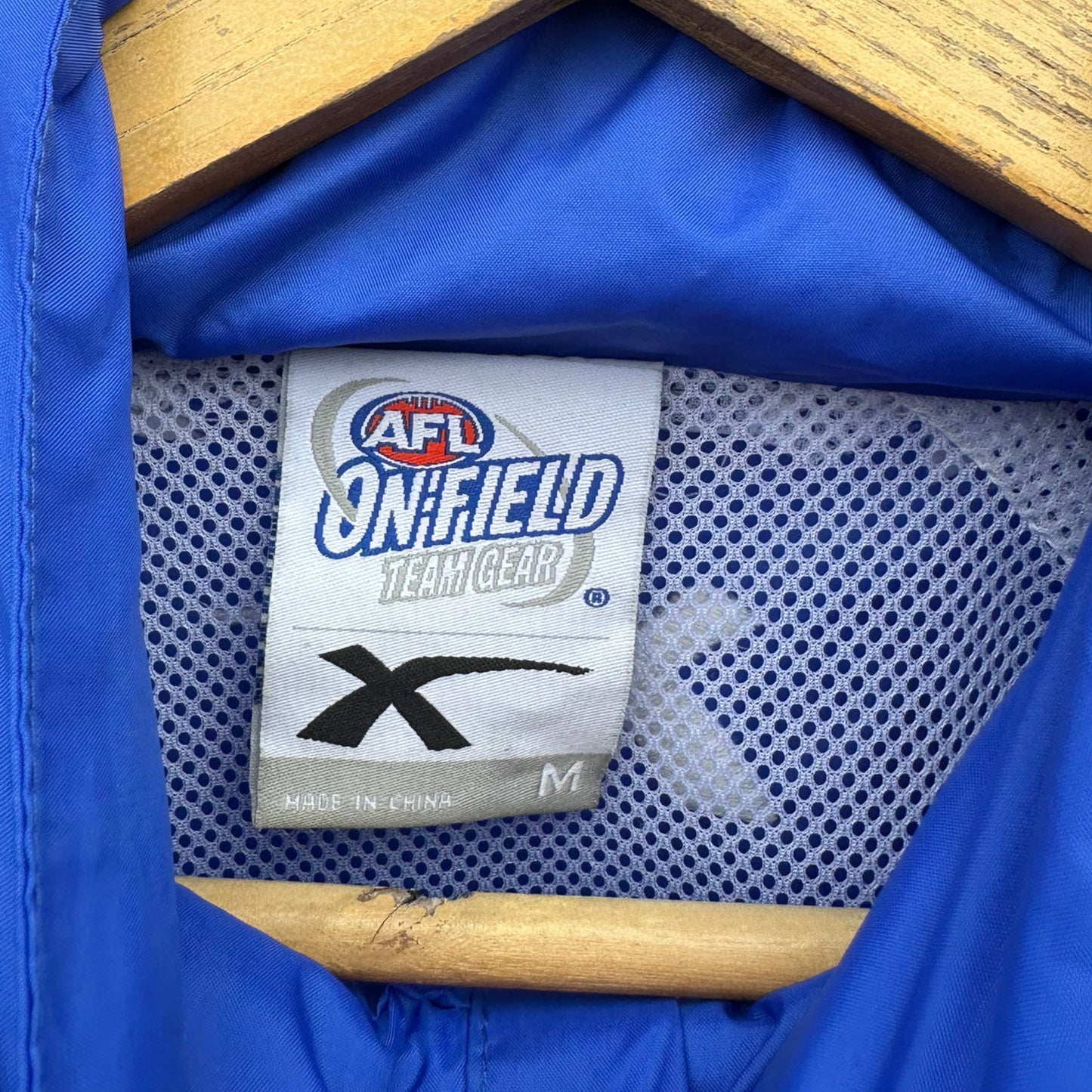 NORTH MELBOURNE KANGAROOS XBLADES ON FIELD BLUE WINDBREAKER JACKET