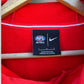 SYDNEY SWANS NIKE ON FIELD RED HOODED JUMPER