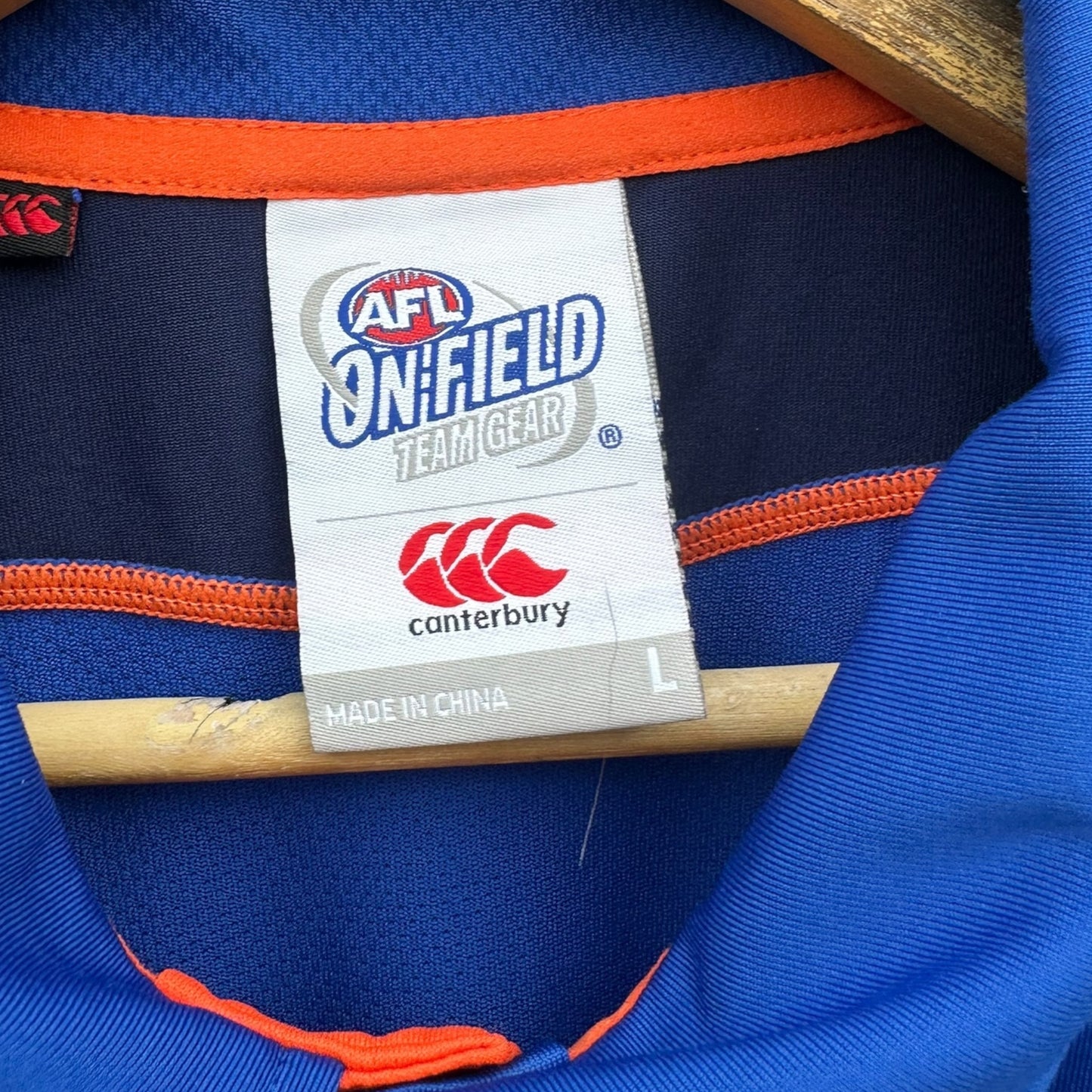 NORTH MELBOURNE KANGAROOS ON FIELD CANTERBURY MEDIA POLO SHIRT