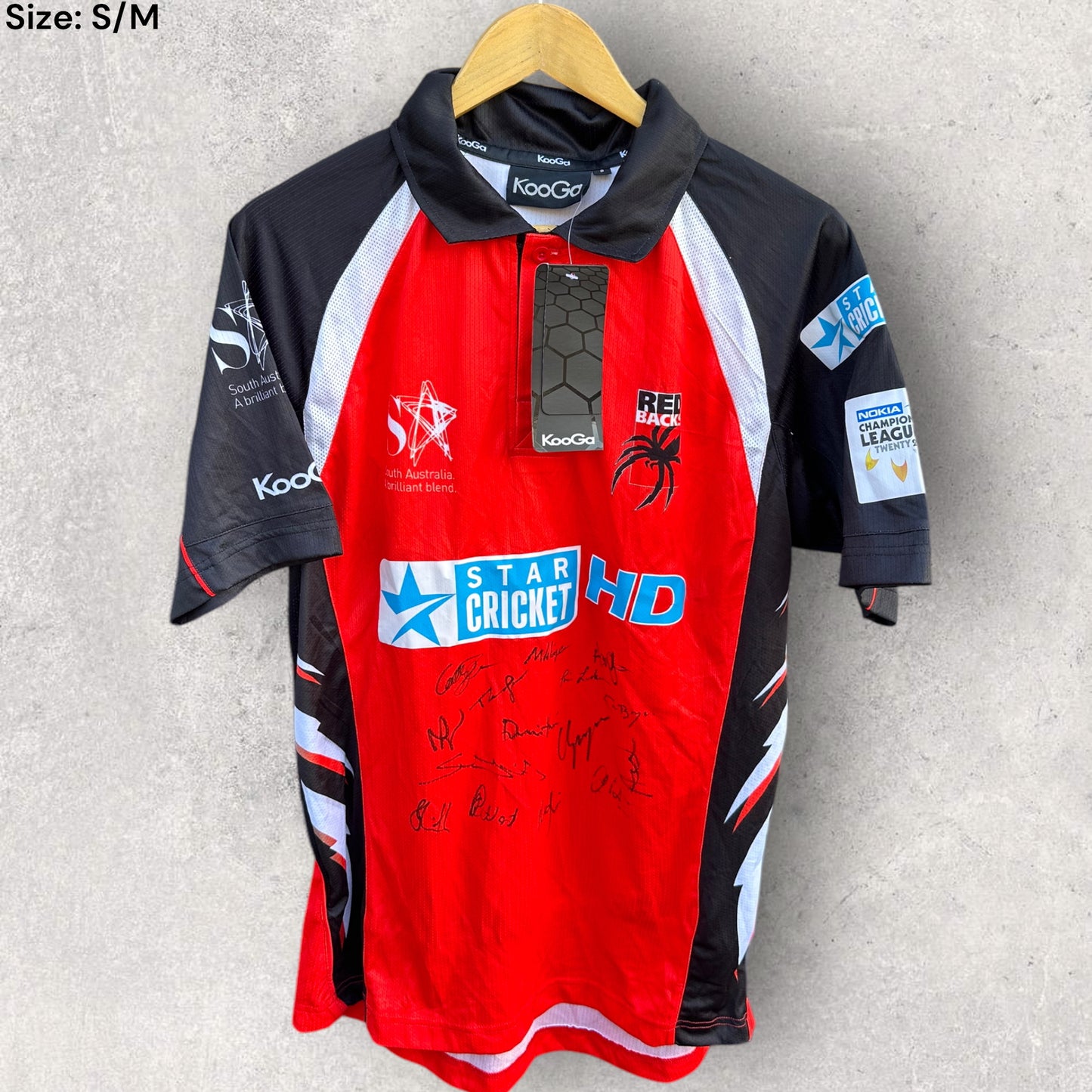 SOUTH AUSTRALIAN REDBACKS CHAMPIONS LEAGUE CRICKET 2010 TEAM SIGNED JERSEY NEW WITH TAGS