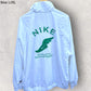 NIKE WOVEN WHITE/MALACHITE WINDBREAKER JACKET