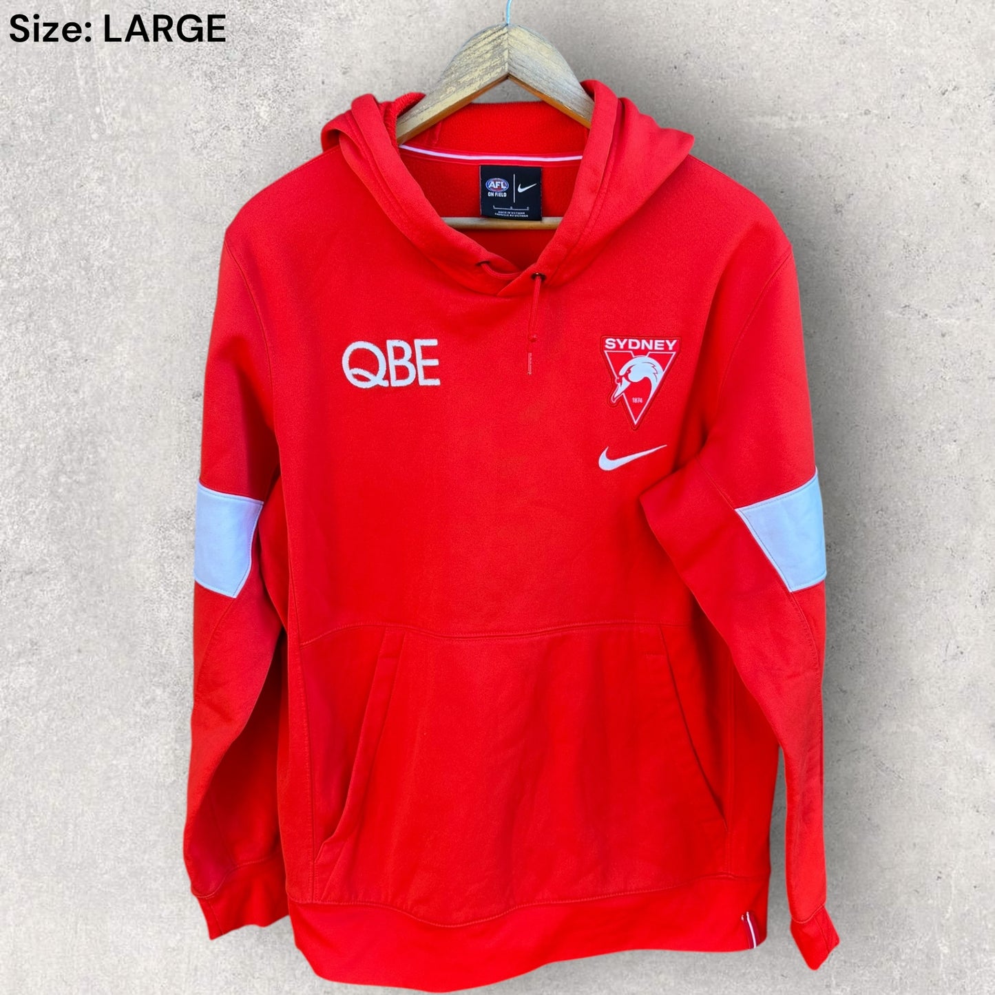 SYDNEY SWANS NIKE ON FIELD RED HOODED JUMPER