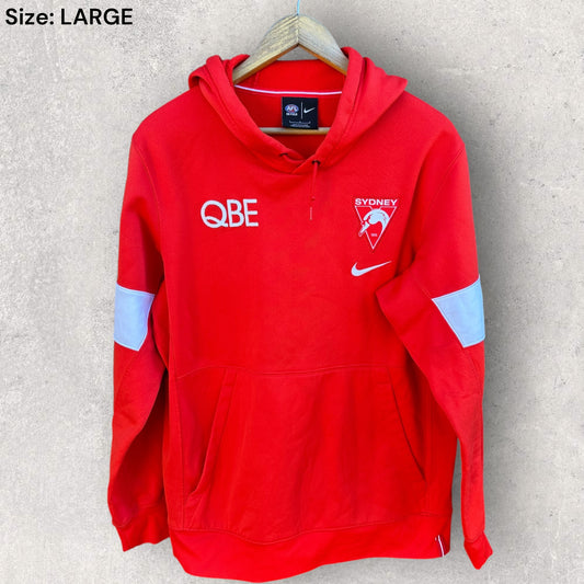 SYDNEY SWANS NIKE ON FIELD RED HOODED JUMPER